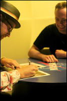 Opus and Kevin sign autographs