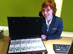 Jill Alexander with a briefcase of Polish zloty